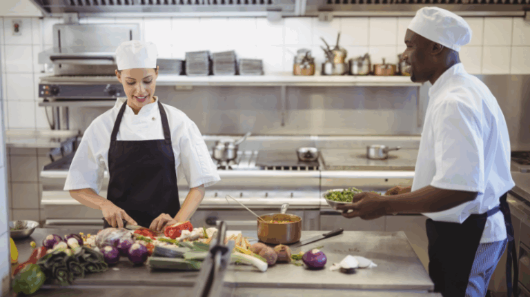 chefs chopping in kitchen